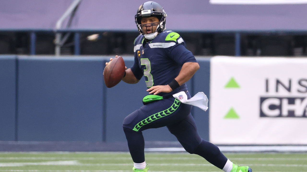 SEATTLE, WASHINGTON - JANUARY 09: Quarterback Russell Wilson #3 of the Seattle Seahawks drops back to pass during the second quarter of the NFC Wild Card Playoff game against the Los Angeles Rams at Lumen Field on January 09, 2021 in Seattle, Washington.