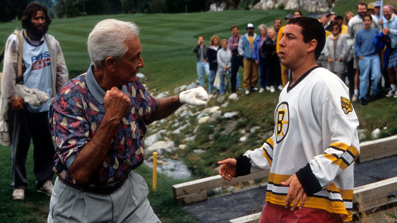 Bob Barker prepares to punch Adam Sandler in a scene from the film 'Happy Gilmore', 1996.