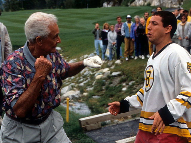 Bob Barker prepares to punch Adam Sandler in a scene from the film 'Happy Gilmore', 1996.