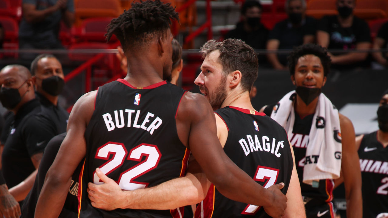 MIAMI, FL - FEBRUARY 26: Jimmy Butler #22 of the Miami Heat hugs Goran Dragic #7 of the Miami Heat during the game against the Utah Jazz on February 26, 2021 at American Airlines Arena in Miami, Florida. Mandatory Copyright Notice: Copyright 2021 NBAE