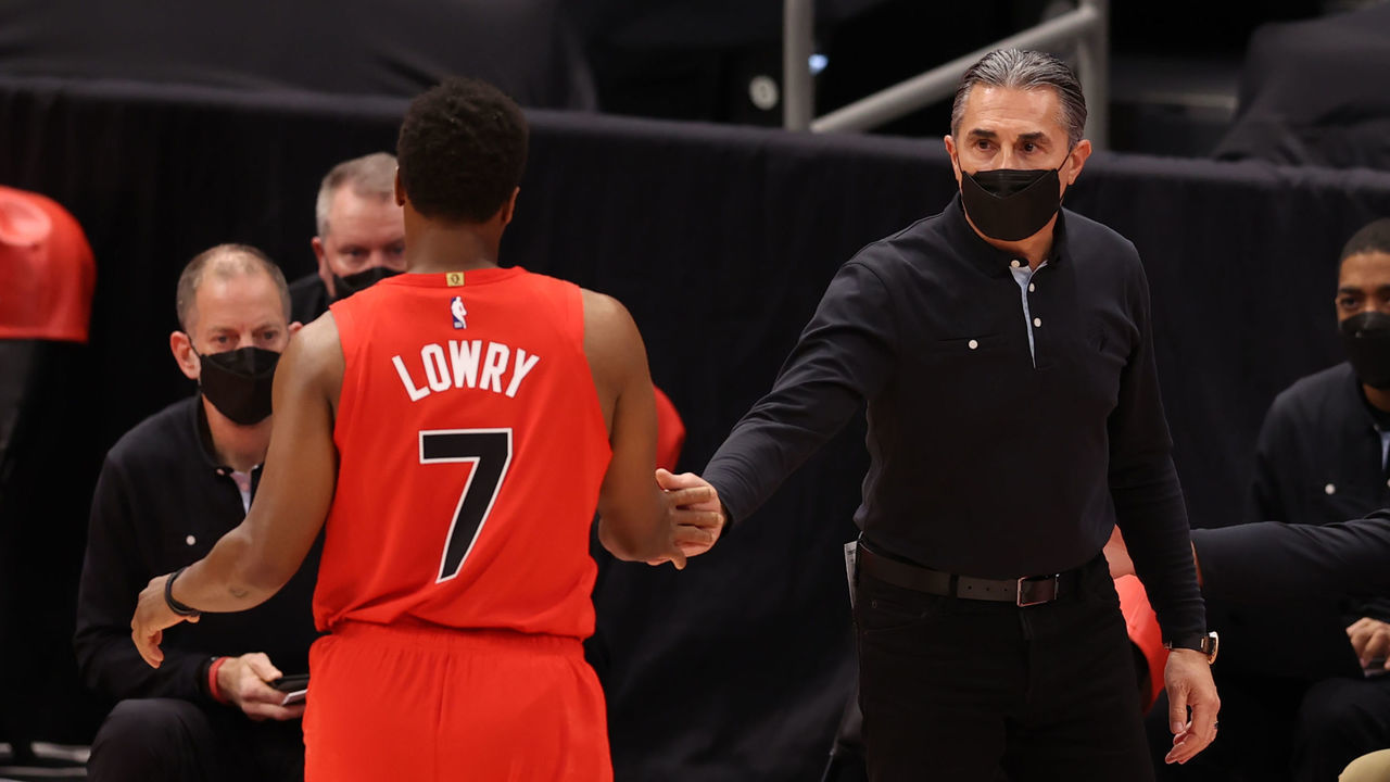TAMPA, FL- FEBRUARY 26: Acting Head Coach Sergio Scariolo and Kyle Lowry #7 of the Toronto Raptors hi-five during the game against the Houston Rockets on February 26, 2021 at Amalie Arena in Tampa, Florida. Mandatory Copyright Notice: Copyright 2021 NBAE