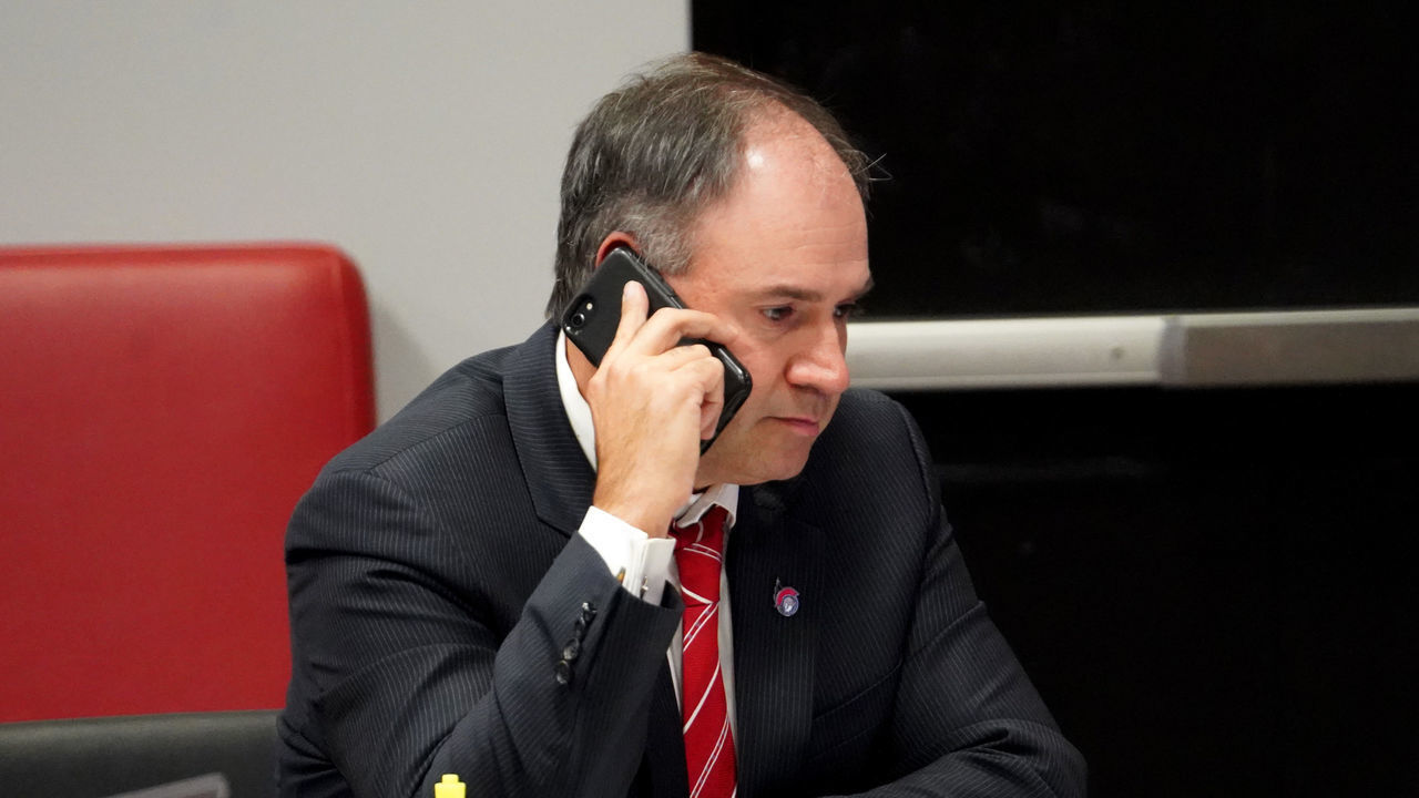 KANATA, ON - OCTOBER 06: General manager Pierre Dorion of the Ottawa Senators sits at the draft table during the first round of the 2020 NHL Entry Draft at Canadian Tire Centre on October 06, 2020 in Kanata, Ontario, Canada. The 2020 NHL Draft was held virtually due to the ongoing Coronavirus pandemic.