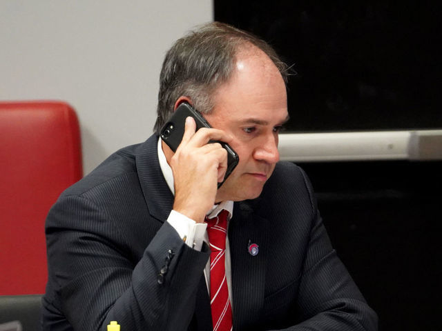 KANATA, ON - OCTOBER 06: General manager Pierre Dorion of the Ottawa Senators sits at the draft table during the first round of the 2020 NHL Entry Draft at Canadian Tire Centre on October 06, 2020 in Kanata, Ontario, Canada. The 2020 NHL Draft was held virtually due to the ongoing Coronavirus pandemic.