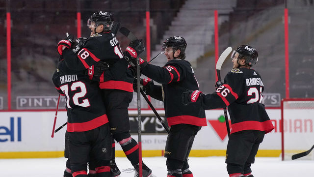 OTTAWA, ON - FEBRUARY 23: Tim Stützle #18 jumps into the arms of Thomas Chabot #72 of the Ottawa Senators to celebrate a shootout win against the Montreal Canadiens at Canadian Tire Centre on February 23, 2021 in Ottawa, Ontario, Canada.