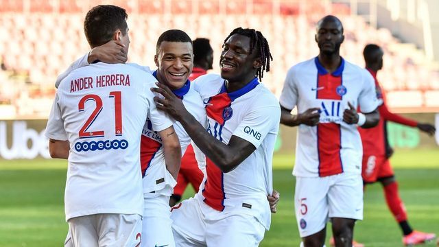 Paris Saint-Germain's French forward Kylian Mbappe (C) celebrates with Paris Saint-Germain's Spanish midfielder Ander Herrera and Paris Saint-Germain's Italian forward Moise Kean (R) after scoring a penalty kick during the French L1 football match between Dijon (DFCO) and Paris Saint-Germain (PSG) at the Gaston Gerard stadium in Dijon, central France, on February 27, 2021.