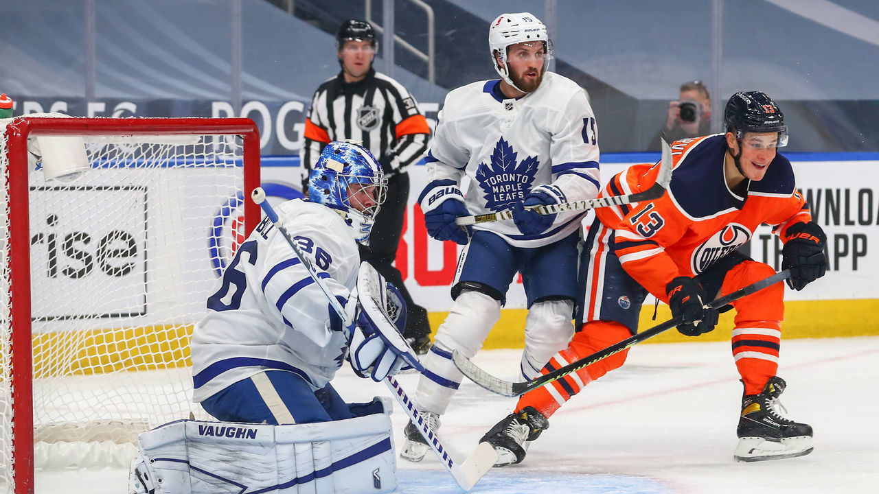 EDMONTON, AB - FEBRUARY 27: .Edmonton Oilers Right Wing Jesse Puljujarvi (13) battles in front of Toronto Maple Leafs Goalie Jack Campbell (36) in the first period during the Edmonton Oilers game versus the Toronto Maple Leafs on February 27, 2021 at Rogers Place in Edmonton, AB.