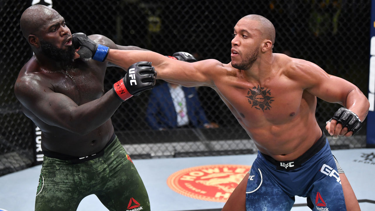 LAS VEGAS, NEVADA - FEBRUARY 27: (R-L) Ciryl Gane of France punches Jairzinho Rozenstruik of Suriname in a heavyweight bout during the UFC Fight Night event at UFC APEX on February 27, 2021 in Las Vegas, Nevada.