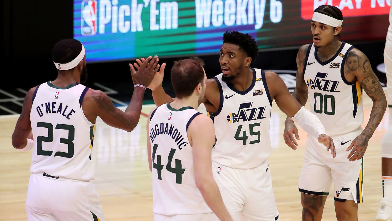 LOS ANGELES, CALIFORNIA - FEBRUARY 19: Donovan Mitchell #45 reacts to a play with Royce O'Neale #23 and Bojan Bogdanovic #44 of the Utah Jazz at the end of the second quarter against the Los Angeles Clippers at Staples Center on February 19, 2021 in Los Angeles, California.