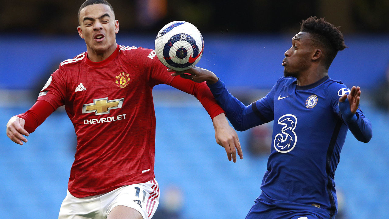 LONDON, ENGLAND - FEBRUARY 28: The ball hits the hand of Callum Hudson-Odoi of Chelsea as he is is challenged by Mason Greenwood of Manchester United which was reviewed by VAR during the Premier League match between Chelsea and Manchester United at Stamford Bridge on February 28, 2021 in London, England. Sporting stadiums around the UK remain under strict restrictions due to the Coronavirus Pandemic as Government social distancing laws prohibit fans inside venues resulting in games being played behind closed doors.