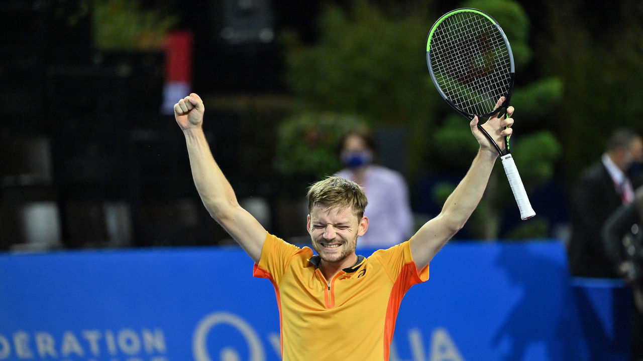 Belgium's David Goffin raises his arms in victory as he wins the final of the ATP World Tour Open Sud de France tennis tournament against Spain's Roberto Bautista Agut in Montpellier on February 28, 2021.