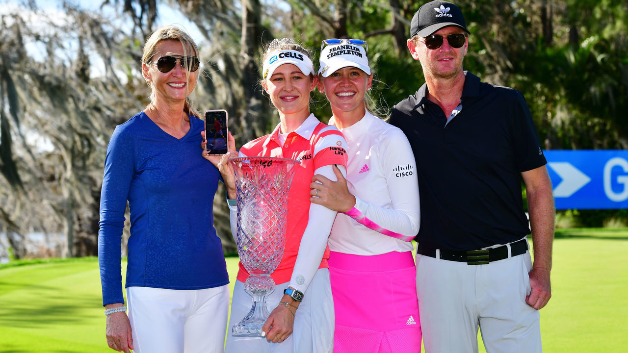 ORLANDO, FLORIDA - FEBRUARY 28: Nelly Korda of the United States poses with her family and the trophy following the final round of the Gainbridge LPGA at Lake Nona Golf and Country Club on February 28, 2021 in Orlando, Florida.