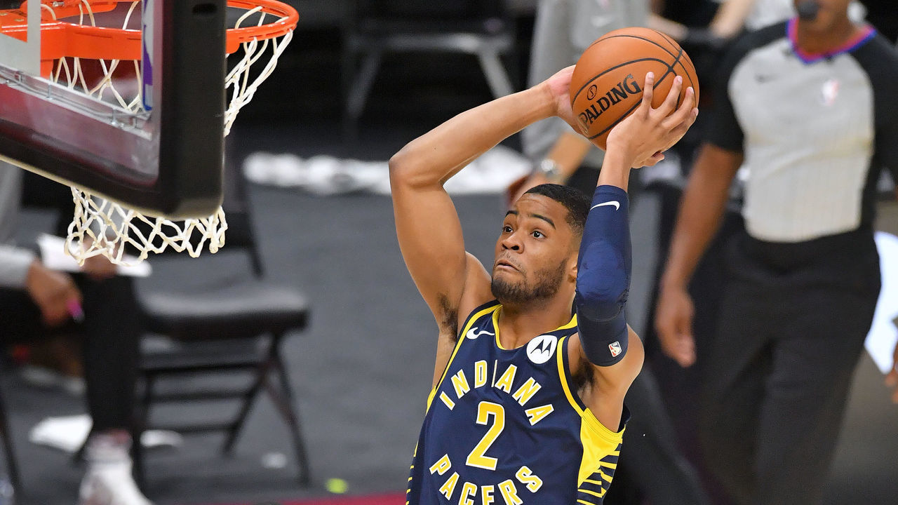 CLEVELAND, OHIO - DECEMBER 12: Cassius Stanley #2 of the Indiana Pacers dunks over Thon Maker #14 of the Cleveland Cavaliers during the second half of a preseason game at Rocket Mortgage Fieldhouse on December 12, 2020 in Cleveland, Ohio. NOTE TO USER: User expressly acknowledges and agrees that, by downloading and/or using this Photograph, user is consenting to the terms and conditions of the Getty Images License Agreement.