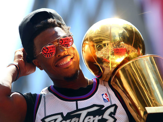 TORONTO, ON - JUNE 17: Kyle Lowry #7 of the Toronto Raptors holds the championship trophy during the Toronto Raptors Victory Parade on June 17, 2019 in Toronto, Canada. The Toronto Raptors beat the Golden State Warriors 4-2 to win the 2019 NBA Finals.