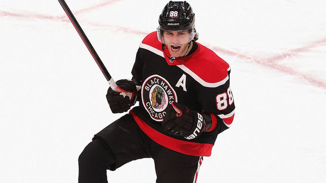 CHICAGO, ILLINOIS - FEBRUARY 28: Patrick Kane #88 of the Chicago Blackhawks celebrates his 400th career goal in the third period against the Detroit Red Wings at the United Center on February 28, 2021 in Chicago, Illinois.