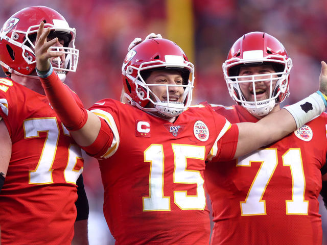 KANSAS CITY, MISSOURI - JANUARY 19: Patrick Mahomes #15 of the Kansas City Chiefs reacts with teammates Eric Fisher #72 and Mitchell Schwartz #71 after a fourth quarter touchdown pass against the Tennessee Titans in the AFC Championship Game at Arrowhead Stadium on January 19, 2020 in Kansas City, Missouri.
