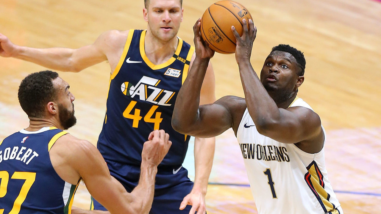 NEW ORLEANS, LOUISIANA - MARCH 01: Zion Williamson #1 of the New Orleans Pelicans looks to shoot against Rudy Gobert #27 and Bojan Bogdanovic #44 of the Utah Jazz during the first half at the Smoothie King Center on March 01, 2021 in New Orleans, Louisiana.