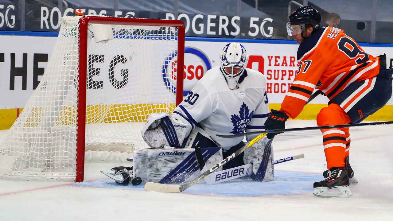 EDMONTON, AB - MARCH 1: Toronto Maple Leafs Goalie Michael Hutchinson (30) stops Edmonton Oilers Center Connor McDavid (97) on a breakaway in the third period during the Edmonton Oilers game versus the Toronto Maple Leafs on March 1, 2021 at Rogers Place in Edmonton, AB.