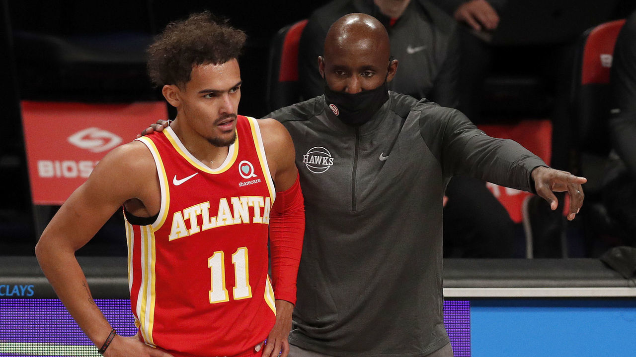 NEW YORK, NEW YORK - DECEMBER 30: (NEW YORK DAILIES OUT) Head coach Lloyd Pierce and Trae Young #11 of the Atlanta Hawks in action against the Brooklyn Nets at Barclays Center on December 30, 2020 in New York City. The Nets defeated the Hawks 145-141. NOTE TO USER: User expressly acknowledges and agrees that, by downloading and/or using this photograph, user is consenting to the terms and conditions of the Getty Images License Agreement.