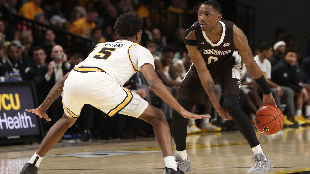 RICHMOND, VA - JANUARY 18: St. Bonaventure Bonnies guard Kyle Lofton (0) dribbles the ball while attempting to elude VCU Rams guard Nah'Shon Hyland (5) during a game between the St. Bonaventure Bonnies and the VCU Rams on January 18, 2020, at the Stuart C. Siegel Center in Richmond, VA.