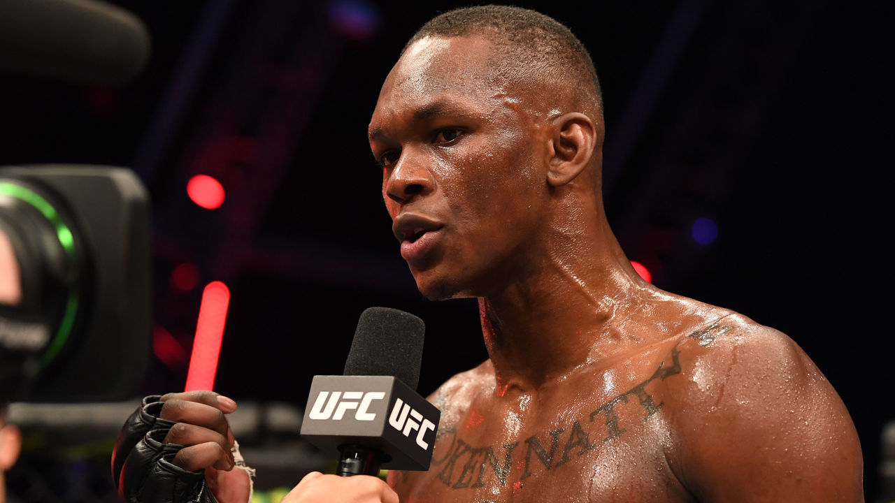 ABU DHABI, UNITED ARAB EMIRATES - SEPTEMBER 27: Israel Adesanya of Nigerian is interviewed after defeating Paulo Costa of Brazil in their middleweight championship bout during UFC 253 inside Flash Forum on UFC Fight Island on September 27, 2020 in Abu Dhabi, United Arab Emirates.