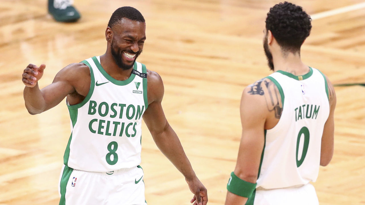 BOSTON, MA - MARCH 02: Kemba Walker #8 embraces Jayson Tatum #0 of the Boston Celtics after a win over the Los Angeles Clippers at TD Garden on March 2, 2021 in Boston, Massachusetts.