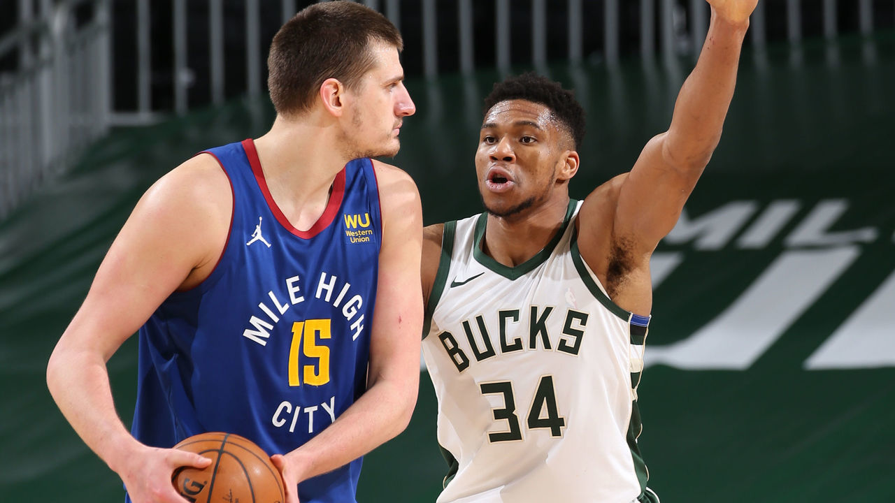 MILWAUKEE, WI - MARCH 2: Giannis Antetokounmpo #34 of the Milwaukee Bucks plays defense on Nikola Jokic #15 of the Denver Nuggets during the game on March 2, 2021 at the Fiserv Forum Center in Milwaukee, Wisconsin. Mandatory Copyright Notice: Copyright 2021 NBAE .