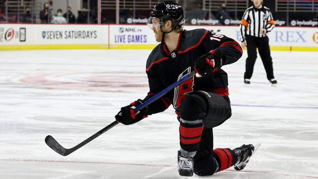 RALEIGH, NC - JANUARY 30: Dougie Hamilton #19 of the Carolina Hurricanes controls the puck on the ice during an NHL game against the Dallas Stars on January 30, 2021 at PNC Arena in Raleigh, North Carolina.