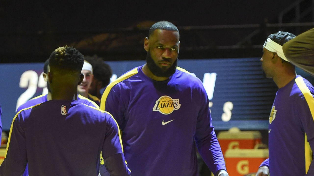 LOS ANGELES, CA - MARCH 2: LeBron James #23 of the Los Angeles Lakers high fives his teammates before the game against the Phoenix Suns on March 2, 2021 at STAPLES Center in Los Angeles, California. NOTE TO USER: User expressly acknowledges and agrees that, by downloading and/or using this Photograph, user is consenting to the terms and conditions of the Getty Images License Agreement. Mandatory Copyright Notice: Copyright 2021 NBAE
