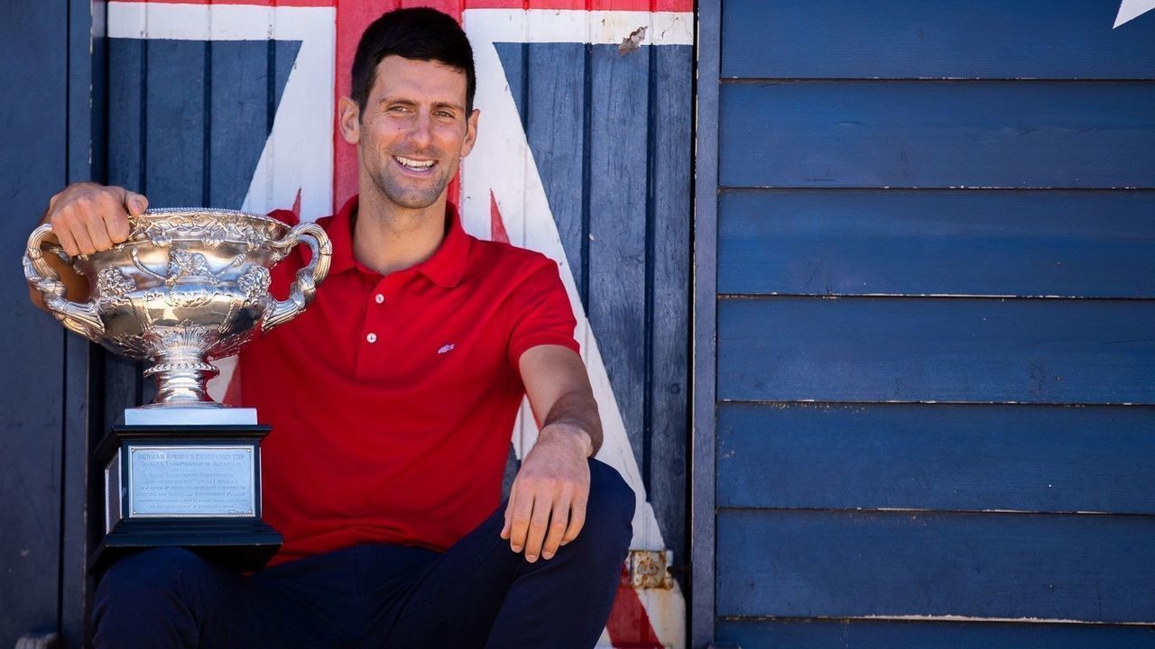 MELBOURNE, Feb. 22, 2021 -- 2021 Australian Open champion Serbia's Novak Djokovic poses for photos with champion trophy at Melbourne Brighton Beach, in Melbourne, Australia, Feb. 22, 2021.