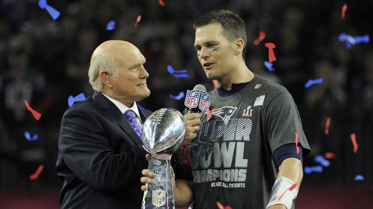 HOUSTON, TX - FEBRUARY 05: Tom Brady #12 of the New England Patriots with the Vince Lombardi trophy talks with Fox analyst Terry Bradshaw after the Patriots defeat the Atlanta Falcons 34-28 in overtime of Super Bowl 51 at NRG Stadium on February 5, 2017 in Houston, Texas.