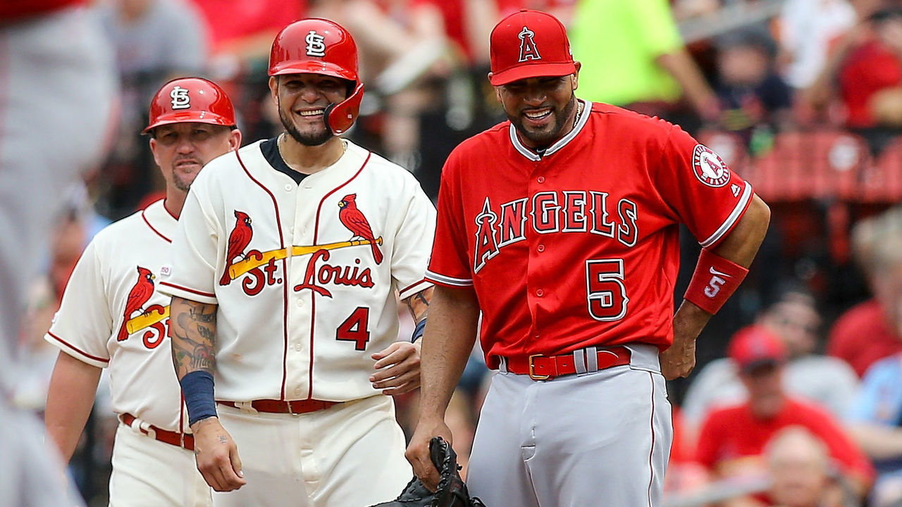 ST. LOUIS, MO - JUNE 22: Former teammates Yadier Molina #4 of the St. Louis Cardinals and Albert Pujols #5 of the Los Angeles Angels of Anaheim share a laugh after Molina hit a single during the fifth inning at Busch Stadium on June 22, 2019 in St. Louis, Missouri.