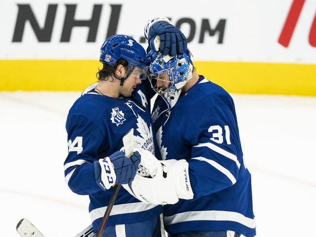 TORONTO, ON - FEBRUARY 4: Auston Matthews #34 and Frederik Andersen #31 of the Toronto Maple Leafs celebrate after defeating the Vancouver Canucks at the Scotiabank Arena on February 4, 2021 in Toronto, Ontario, Canada.