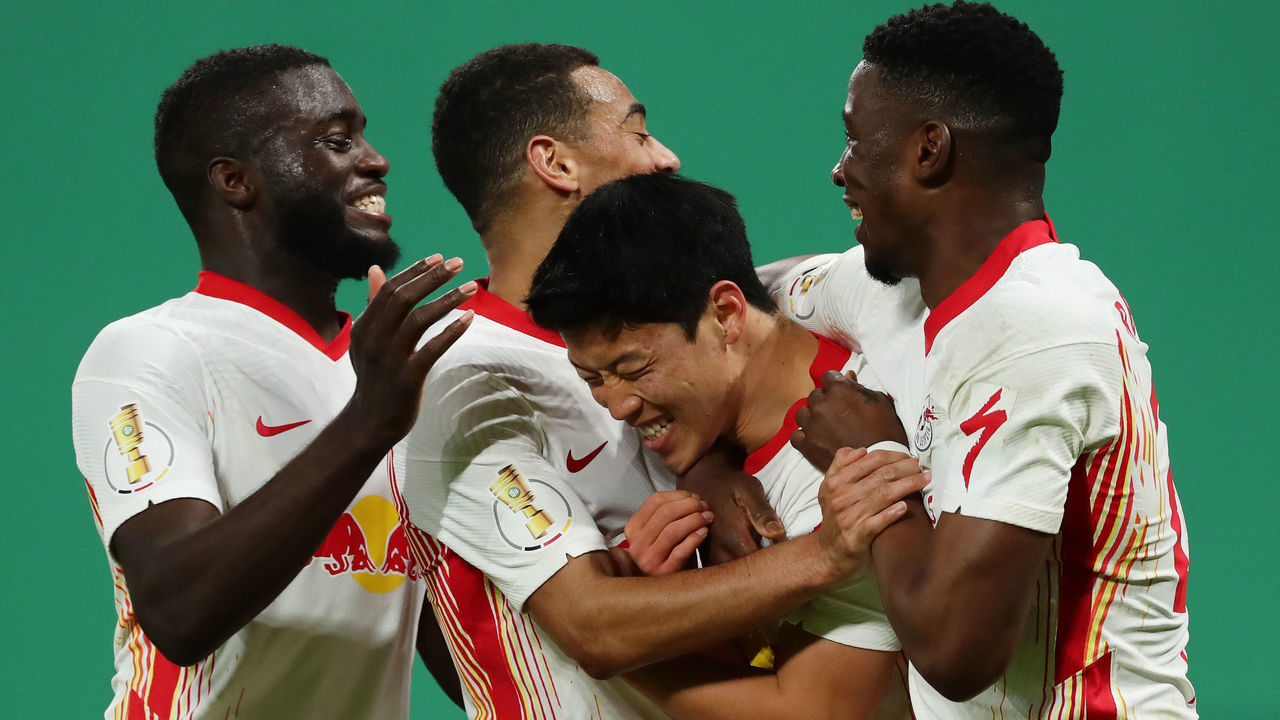 LEIPZIG, GERMANY - MARCH 03: Hee-Chan Hwang of RB Leipzig celebrates with team mates after scoring their side's second goal during the DFB Cup quarter final match between RB Leipzig and VfL Wolfsburg at Red Bull Arena on March 03, 2021 in Leipzig, Germany. Sporting stadiums around Germany remain under strict restrictions due to the Coronavirus Pandemic as Government social distancing laws prohibit fans inside venues resulting in games being played behind closed doors.