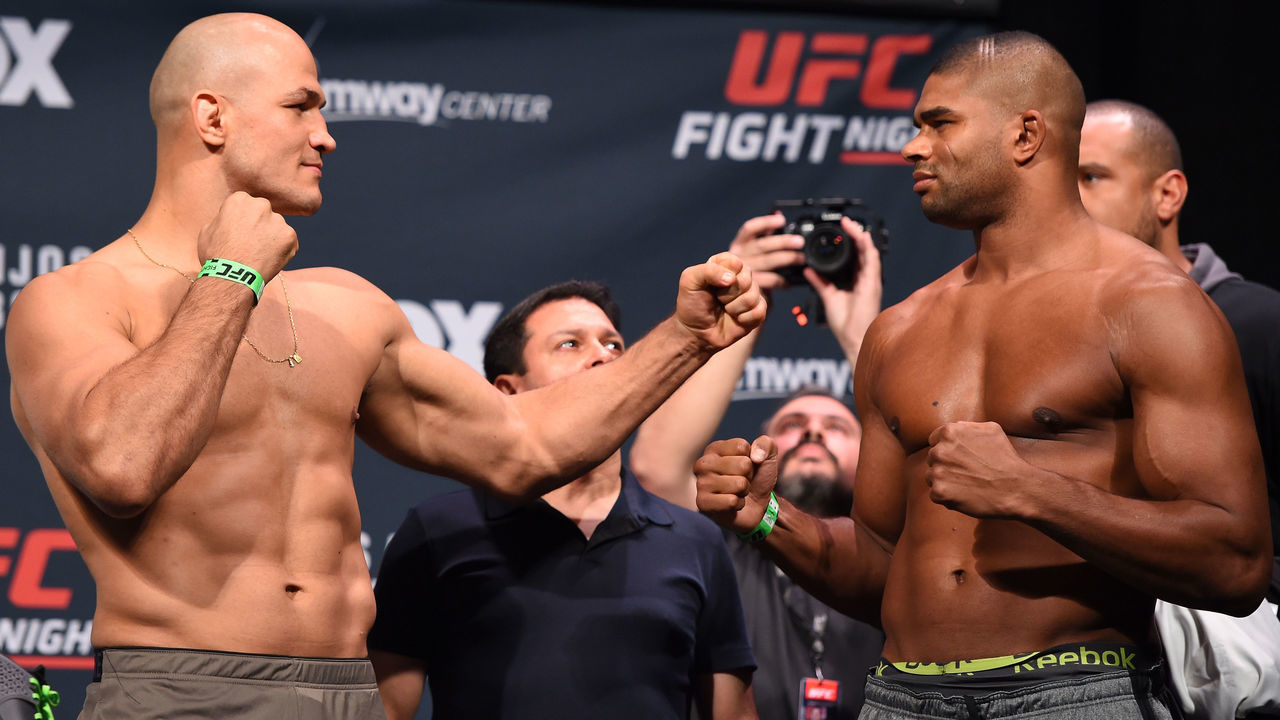 ORLANDO, FL - DECEMBER 18: (L-R) Opponents Junior dos Santos of Brazil and Alistair Overeem of the Netherlands face off during the UFC weigh-in at the Orange County Convention Center on December 18, 2015 in Orlando, Florida.