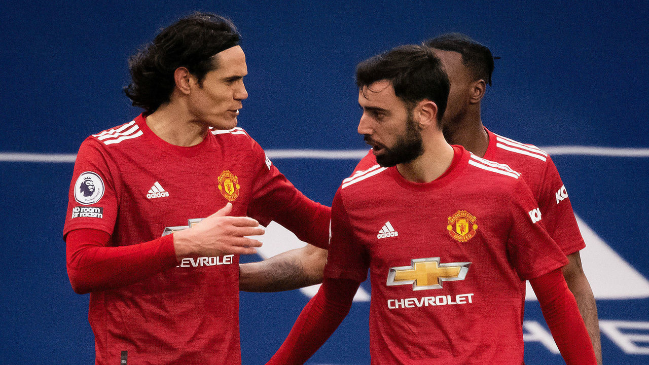 WEST BROMWICH, ENGLAND - FEBRUARY 14: Bruno Fernandes of Manchester United celebrates scoring a goal to make the score 1-1 with Edinson Cavani during the Premier League match between West Bromwich Albion and Manchester United at The Hawthorns on February 14, 2021 in West Bromwich, United Kingdom. Sporting stadiums around the UK remain under strict restrictions due to the Coronavirus Pandemic as Government social distancing laws prohibit fans inside venues resulting in games being played behind closed doors.