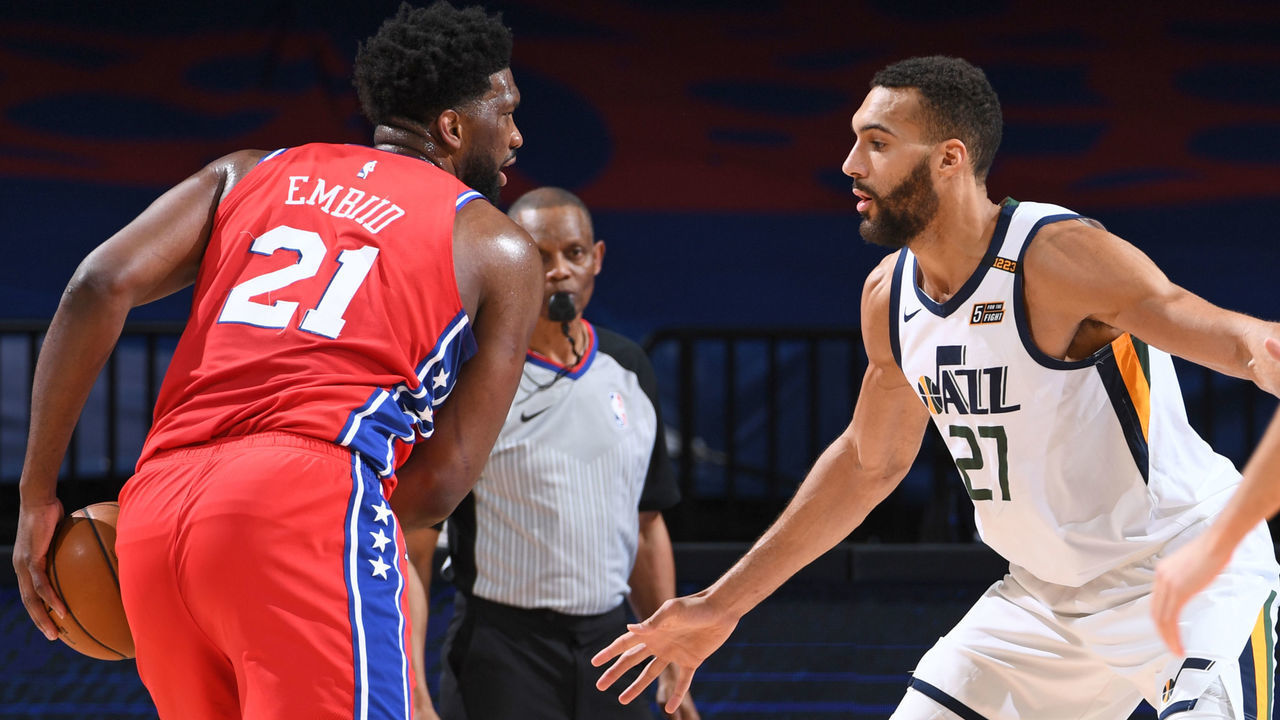 PHILADELPHIA, PA - MARCH 3: Joel Embiid #21 of the Philadelphia 76ers handles the ball against Rudy Gobert #27 of the Utah Jazz on March 3, 2021 at Wells Fargo Center in Philadelphia, Pennsylvania. NOTE TO USER: User expressly acknowledges and agrees that, by downloading and/or using this Photograph, user is consenting to the terms and conditions of the Getty Images License Agreement. Mandatory Copyright Notice: Copyright 2021 NBAE
