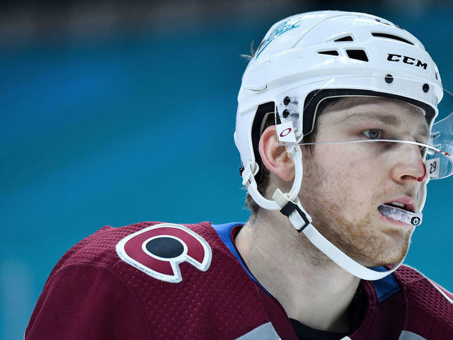 SAN JOSE, CA - MARCH 03: Nathan MacKinnon #29 of the Colorado Avalanche seen bleeding after taking a hit against the San Jose Sharks at SAP Center on March 3, 2021 in San Jose, California.