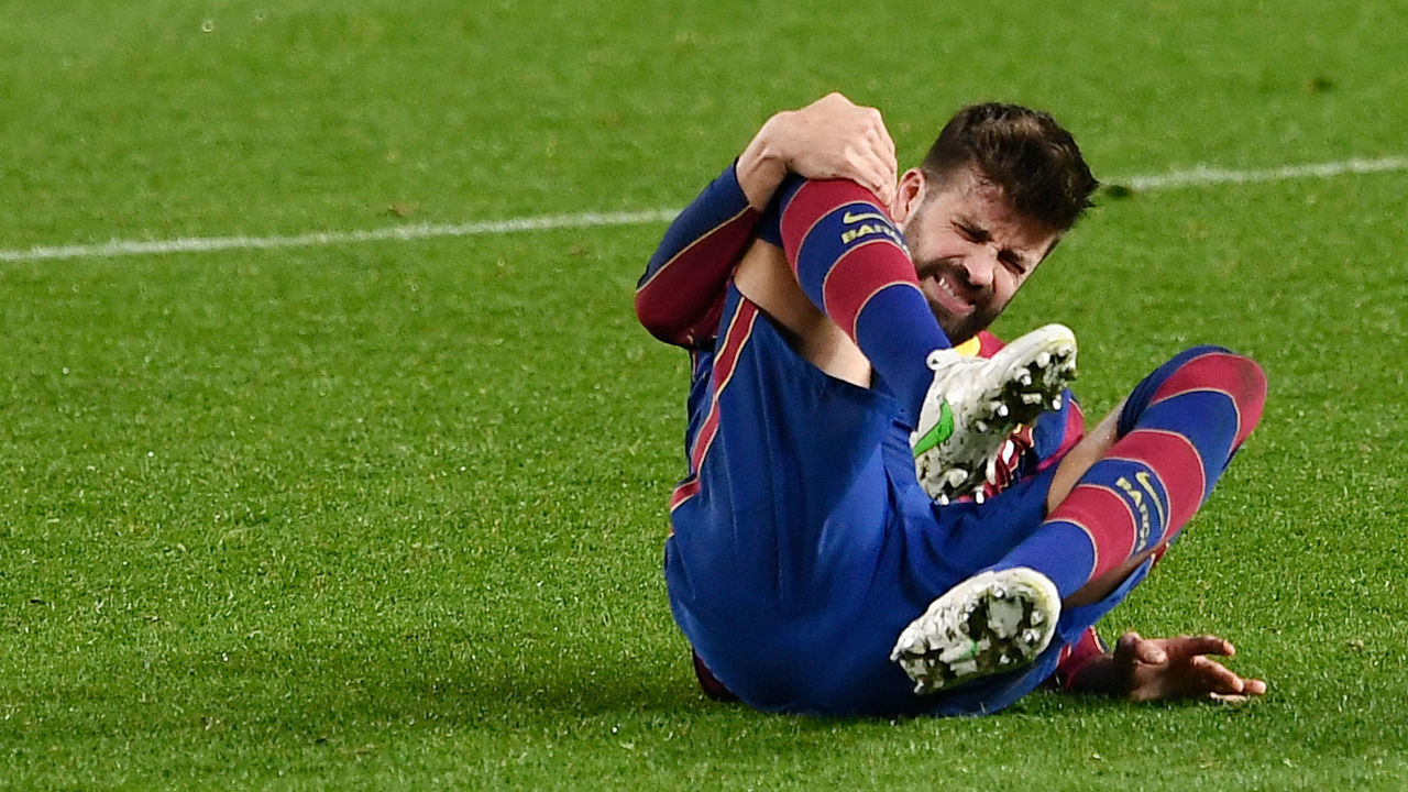 Barcelona's Spanish defender Gerard Pique touches his knee during Spanish Copa del Rey (King's Cup) semi-final second leg football match between FC Barcelona and Sevilla FC at the Camp Nou stadium in Barcelona on March 3, 2021.