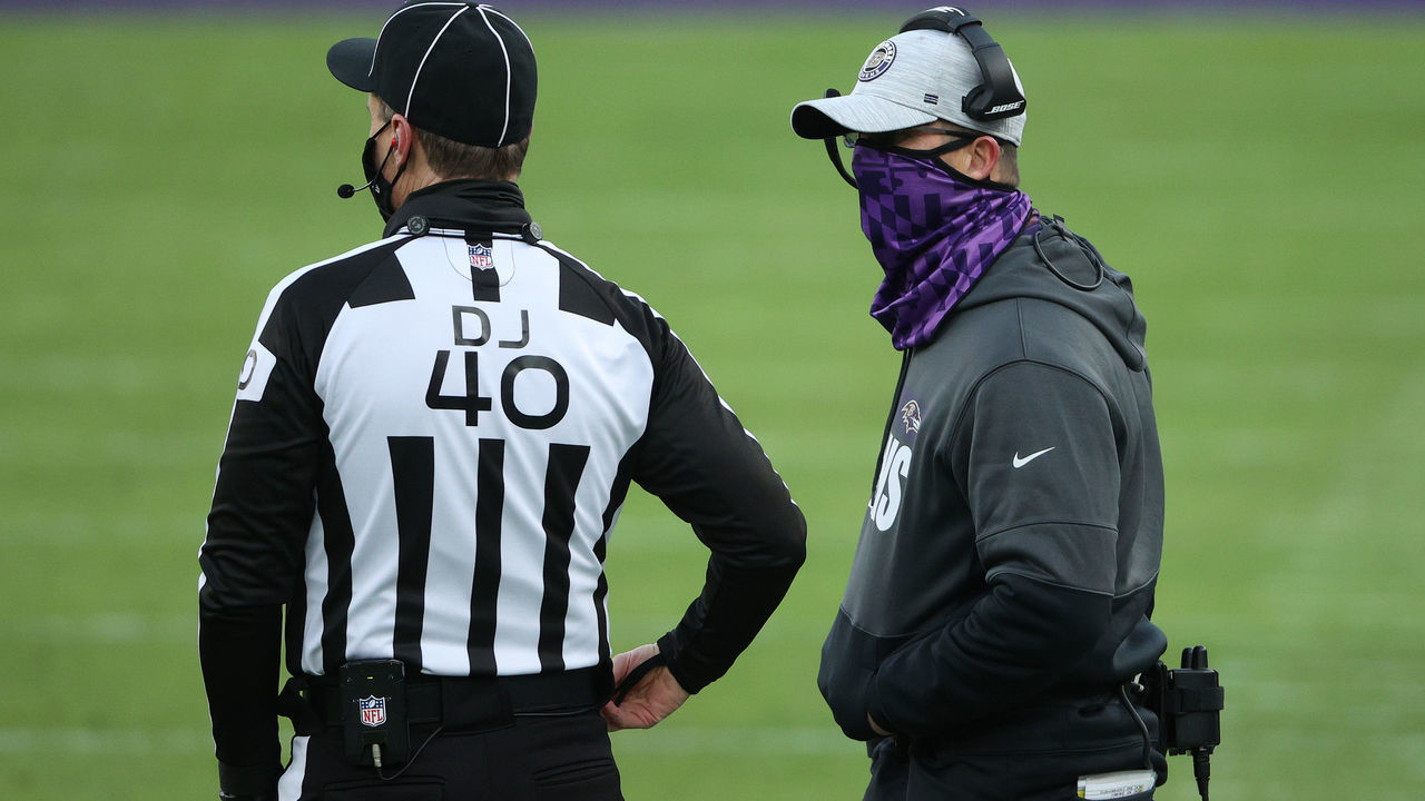 BALTIMORE, MARYLAND - DECEMBER 27: Head coach John Harbaugh of the Baltimore Ravens talks to umpire Butch Hannah #40 during the fourth quarter against the New York Giants at M&T Bank Stadium on December 27, 2020 in Baltimore, Maryland.