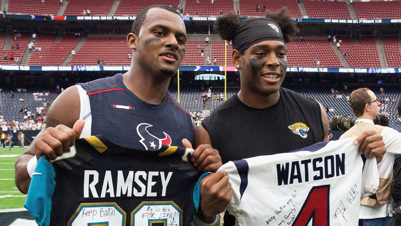 HOUSTON, TX - SEPTEMBER 10: Deshaun Watson #4 of the Houston Texans and Jalen Ramsey #20 of the Jacksonville Jaguars exchange jerseys after the game at NRG Stadium on September 10, 2017 in Houston, Texas.