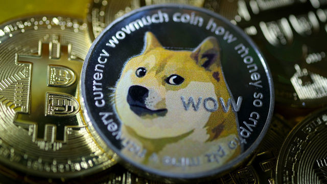 KATWIJK, NETHERLANDS - JANUARY 29: In this photo illustration, visual representations of digital cryptocurrencies, Dogecoin and Bitcoin are arranged on January 29, 2021 in Katwijk, Netherlands.