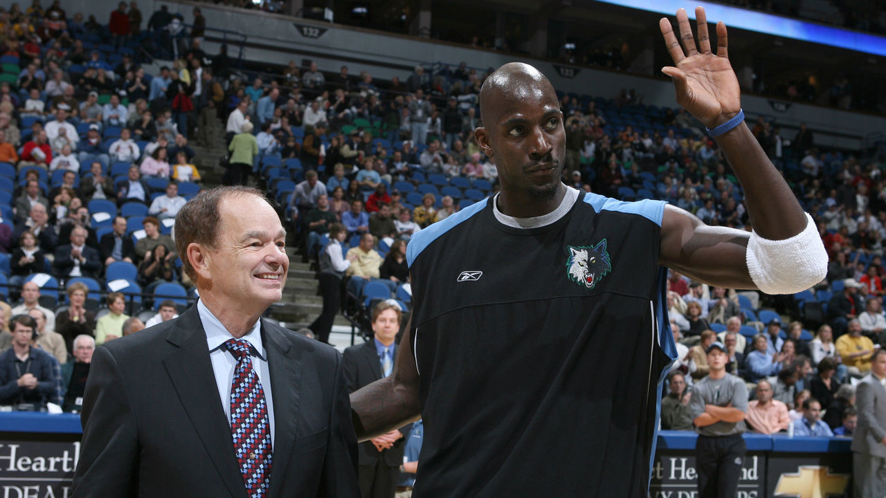 MINNEAPOLIS - NOVEMBER 09: Kevin Garnett #21 of the Minnesota Timberwolves receives an award from Glen Taylor for being a member of the 2004-05 all-defensive first team and the 2004-05 all-NBA second team prior to tonight's game against the Los Angeles Lakers on November 09, 2005 at the Target Center in Minneapolis, Minnesota. NOTE TO USER: User expressly acknowledges and agrees that, by downloading and /or using this Photograph, user is consenting to the terms and conditions of the Getty Images License Agreement: Mandatory Copyright Notice: Copyright 2005 NBAE