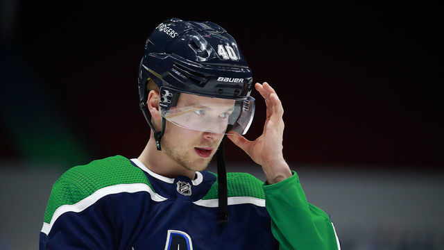 VANCOUVER, BC - FEBRUARY 25: Elias Pettersson #40 of the Vancouver Canucks looks on from the bench during their NHL game against the Edmonton Oilers at Rogers Arena on February 25, 2021 in Vancouver, British Columbia, Canada. "n