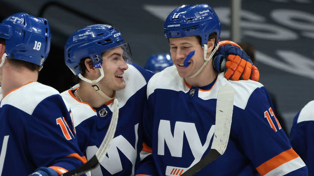 UNIONDALE, NEW YORK - MARCH 04: (l-r) Mathew Barzal #13 and Matt Martin #17 of the New York Islanders celebrate their 5-2 victory over the Buffalo Sabres at the Nassau Coliseum on March 04, 2021 in Uniondale, New York.