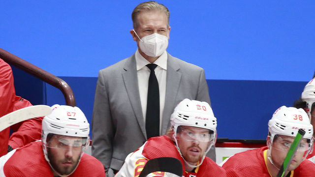 VANCOUVER, BC - FEBRUARY 13: Head coach Geoff Ward of the Calgary Flames looks on from the bench during their NHL game against the Vancouver Canucks at Rogers Arena on February 13, 2021 in Vancouver, British Columbia, Canada. "n