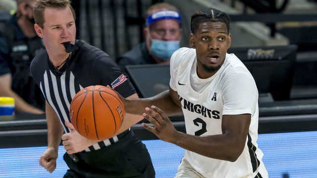 ORLANDO, FL - JANUARY 27: UCF Knights guard Darius Perry (2) looks to pass the ball during the basketball game between the UCF Knights and the and the East Carolina Pirates at Addition Financial Arena on January 27, 2021 in Orlando, FL.