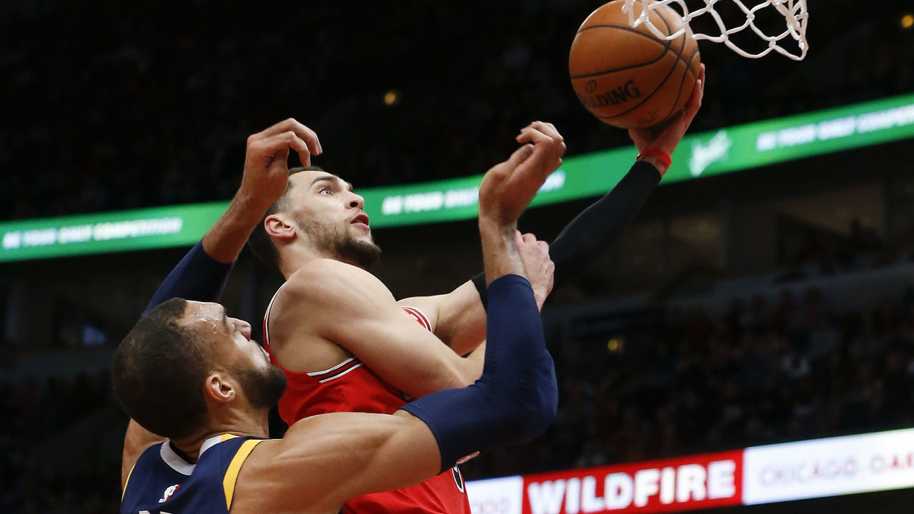 CHICAGO, ILLINOIS - JANUARY 02: Zach LaVine #8 of the Chicago Bulls drives past Rudy Gobert #27 of the Utah Jazz during the first half at United Center on January 02, 2020 in Chicago, Illinois.