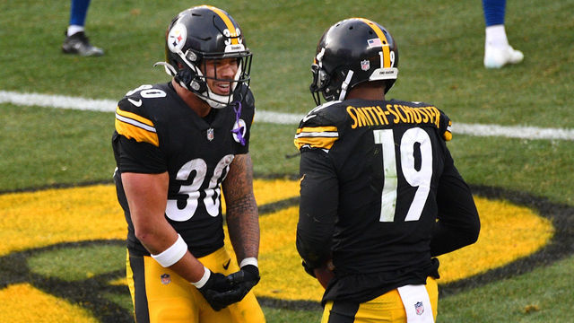 PITTSBURGH, PENNSYLVANIA - DECEMBER 27: Wide receiver JuJu Smith-Schuster #19 of the Pittsburgh Steelers and teammate James Conner #30 react after Smith-Schuster made a touchdown reception against safety Julian Blackmon #32 of the Indianapolis Colts in the fourth quarter of their game at Heinz Field on December 27, 2020 in Pittsburgh, Pennsylvania.