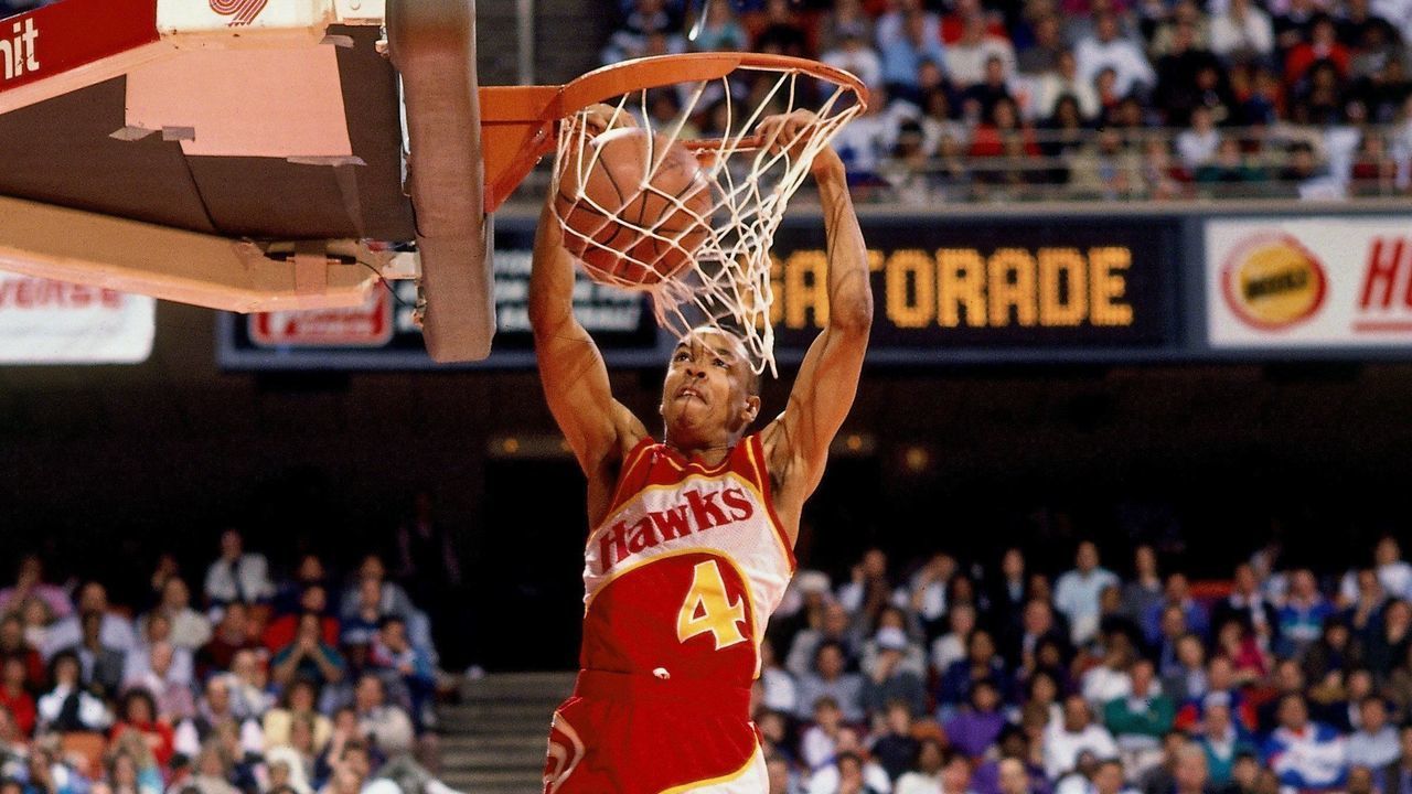 HOUSTON- FEBRUARY 11: Spud Webb #4 of the Atlanta Hawks attempts a dunk during the 1989 Slam Dunk Contest on February 11, 1989 at the Summit in Houston, Texas. NOTE TO USER: User expressly acknowledges that, by downloading and or using this photograph, User is consenting to the terms and conditions of the Getty Images License agreement. Mandatory Copyright Notice: Copyright 1989 NBAE