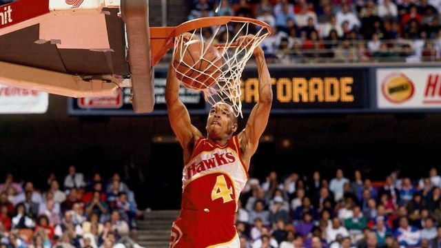 HOUSTON- FEBRUARY 11: Spud Webb #4 of the Atlanta Hawks attempts a dunk during the 1989 Slam Dunk Contest on February 11, 1989 at the Summit in Houston, Texas. NOTE TO USER: User expressly acknowledges that, by downloading and or using this photograph, User is consenting to the terms and conditions of the Getty Images License agreement. Mandatory Copyright Notice: Copyright 1989 NBAE